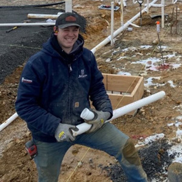 A JM Lapp installer performing commercial service installation.