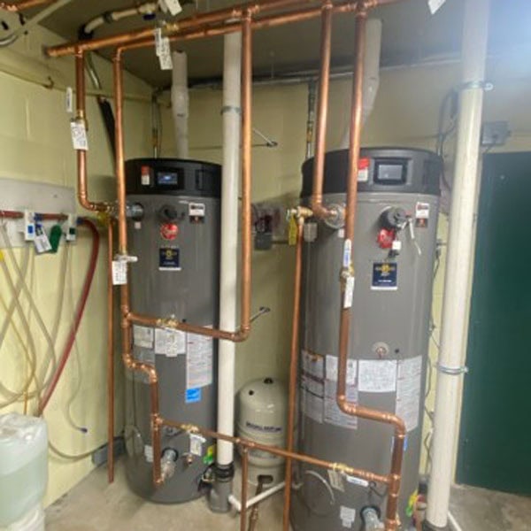 Rheem water heaters installed by JM Lapp in a residential basement located in New Holland, PA.